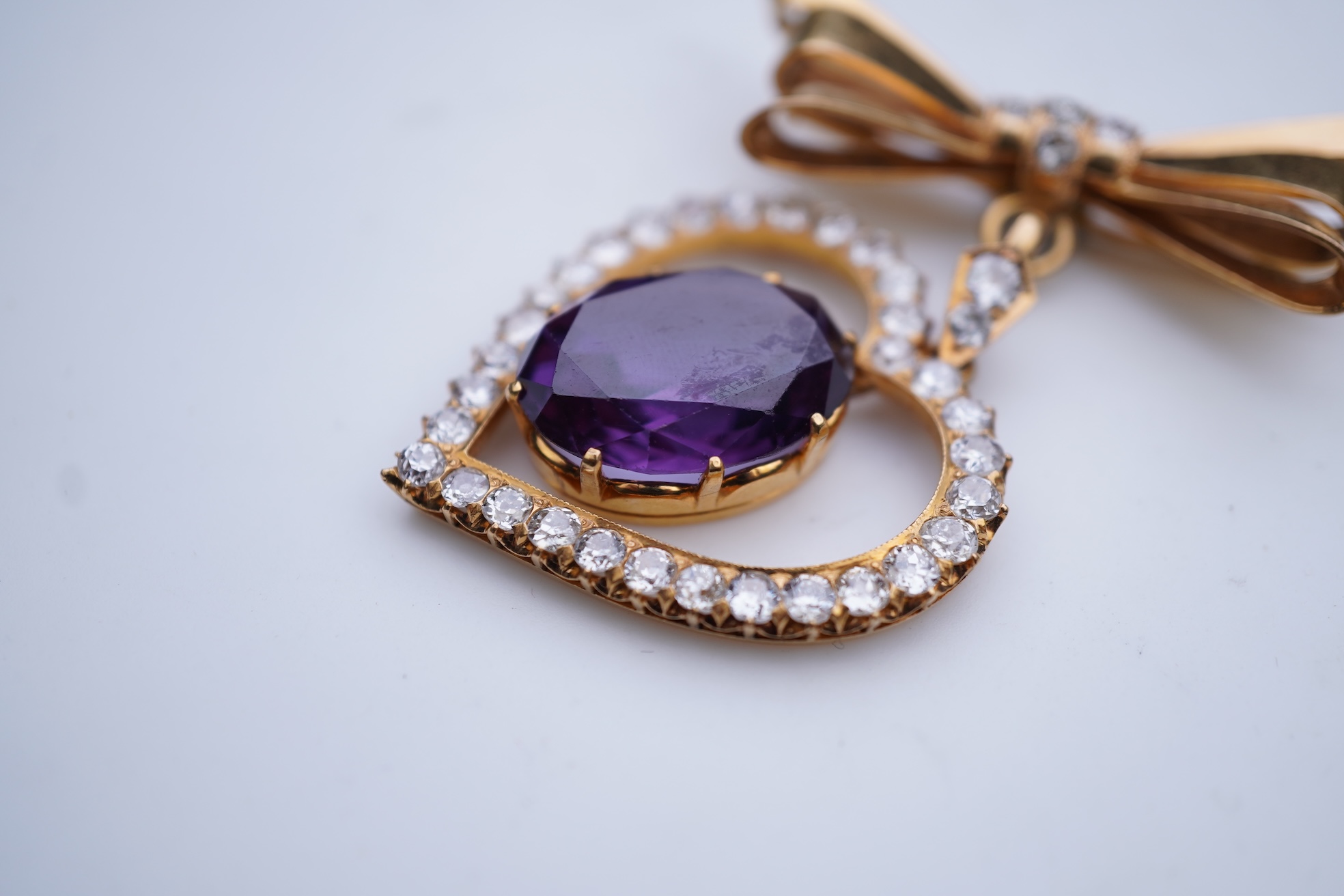 A synthetic sapphire and diamond pendant, mid 20th century